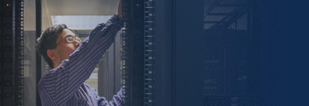 man in data center providing NetApp support and maintenance